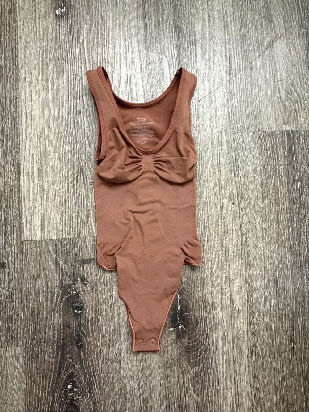 SKIMS Sleeveless One-Piece Bodysuit in Rust Brown
